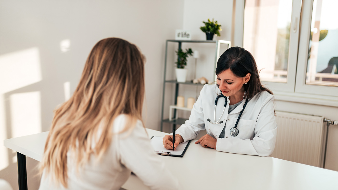 A dentist meeting with a client.