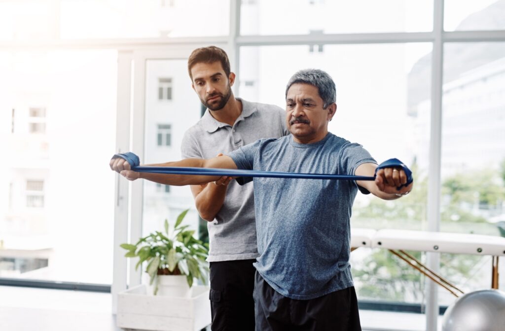 A man wearing loose, comfortable fitting closes to a physiotherapy session