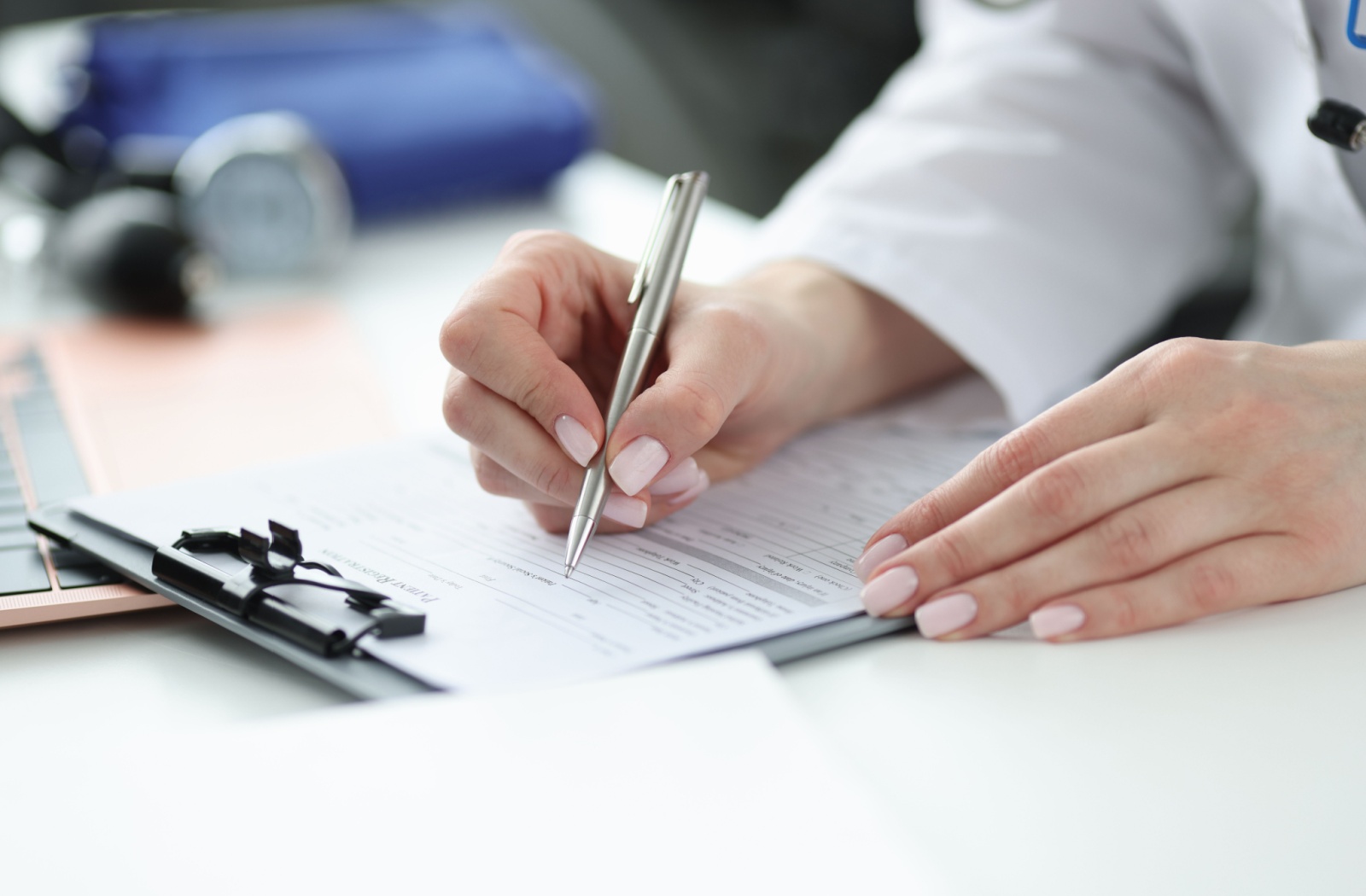 A nurse practitioner writing a prescription
